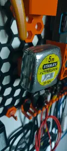 Honeycomb storage wall tape measure holder