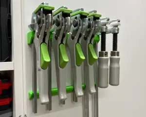 Holder for guiderail clamps