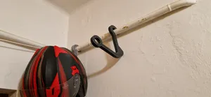 Motorcycle helmet holder