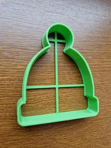 Cookie cutter in the shape of a hat with pompom