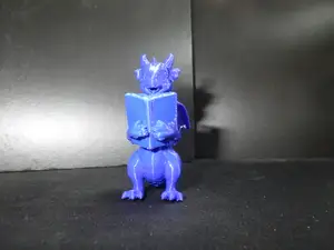A dragon reading a book.