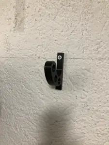 Wall mounted motorcycle helmet holder