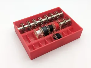 Bottom coil carrier for Sewing machine coils