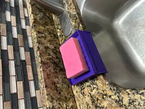 Self-draining sponge holder