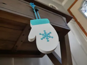 Mitten with snowflake decor