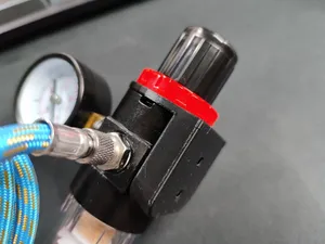 Mount for compressed air pressure regulator/water separator for airbrush station
