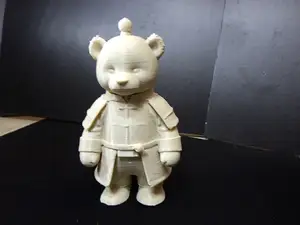 Cute teddy bear in a robe.
