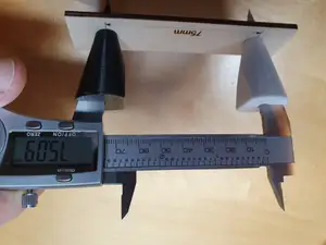 Caliper attachments for measuring distances between hole centers