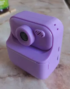 Lens cap for a children's camera with thermal printing