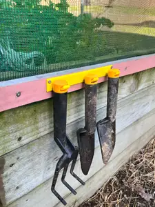 Hooks to hold Fiskars hand gardening tools