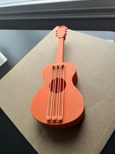 Rubber band powered guitar with pick