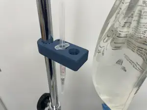 Syringe holder with IV pole clamp