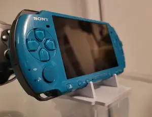 Universal stand for handheld consoles PSP, Vita, DS, DSi, WonderSwan, CD, DVD, ...