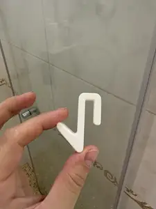 Towel hook on the shower glass door
