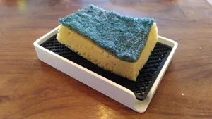 Sponge or soap holder with soap savior drawer
