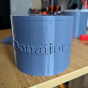 Cylindrical donation box