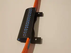 Wall mounted car track tunnel compatible with hotwheels track