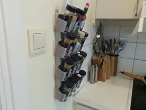 Spice rack tilter brackets