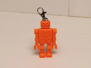 One piece articulated robot keychain with a clip