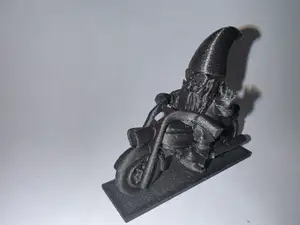 Garden Gnome on a Bike Repaired and Reinforced