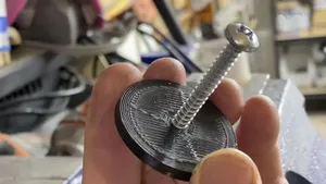 Printed Edge/Lip attached to wooden dowel rod in making filament spool holder