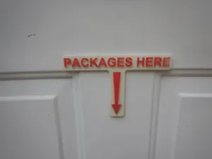 "Packages Here" Sign
