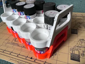 A stackable paint rack / carrier for 11 x 23ml Tamiya paint pots.