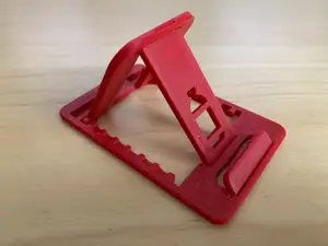 Credit card sized foldable mobile stand