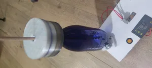Container with a through-hole