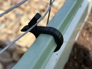 Clip for holding rabbit fencing onto garden raised bed