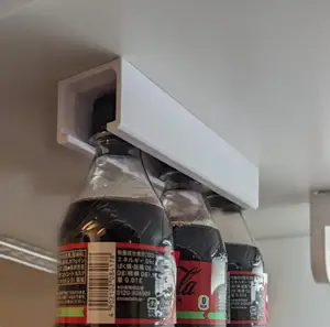 Hanging PET bottle storage with screw holes for affixing anywhere (fits on small printers)
