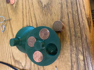 Bottom half holds pennies to add weight