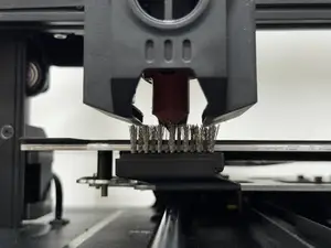 Ender 3 V3 KE and SE automatic nozzle cleaning brush.
