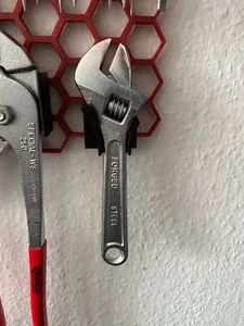 Holder for small adjustable wrench for honeycomb storage wall system (HSW)