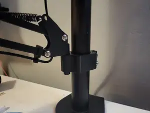 Microphone boom arm hodler to monitor arm