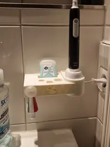 toothbrush holder and toothpaste dispenser combined