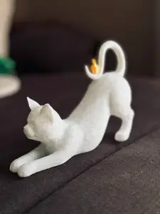 Stretching Cat with Bird on Tail