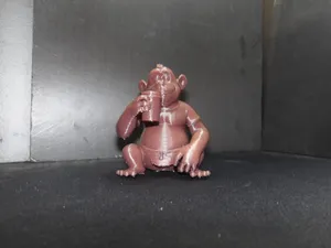 Gorilla drinking a cup of coffee.
