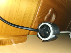 Single extension cord wall holder