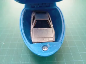 Surprise egg with magnet latching and enlarged to fit a model car.
