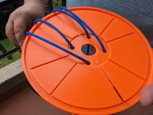 Hand-powered blood sample centrifuge