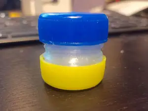 Mini bottle cap container (pill box) for two bottle caps