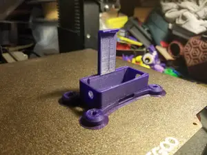 GL iNet Mango MT300N-V2 mount remix with shorter legs, mounting holes, and more!
