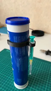 Syringe holder for tube with lubricant