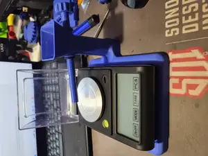 Powder scale base and powder trickler