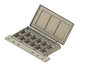 A file clip in travel paint pallet with brush holder and mixing wells