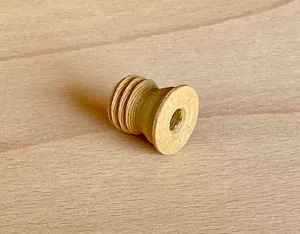 Plug printed with wood filament to close bore in a wooden frame of a window