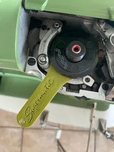 Supermatic sewing machine cam/stitch disc lifter