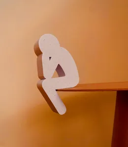 Thinking sitting man