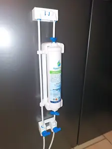 Refrigerator water filter magnetic mount